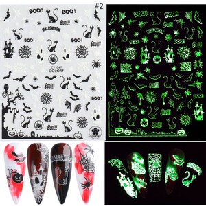 May include: Two sheets of glow-in-the-dark Halloween nail stickers. The first sheet features black and white designs, including bats, spiders, pumpkins, cats, and the words "BOO!" and "HALLOWEEN". The second sheet features the same designs in green.