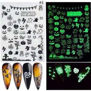 May include: Two sheets of glow-in-the-dark Halloween nail stickers. The left sheet has white stickers with black outlines of pumpkins, ghosts, bats, and a tree. The right sheet has green stickers with black outlines of pumpkins, ghosts, bats, and a tree. The text on the sheets reads "Pumpkins scream in the dead of night, we are very afraid, who can help us?" and "Trick or Treat".