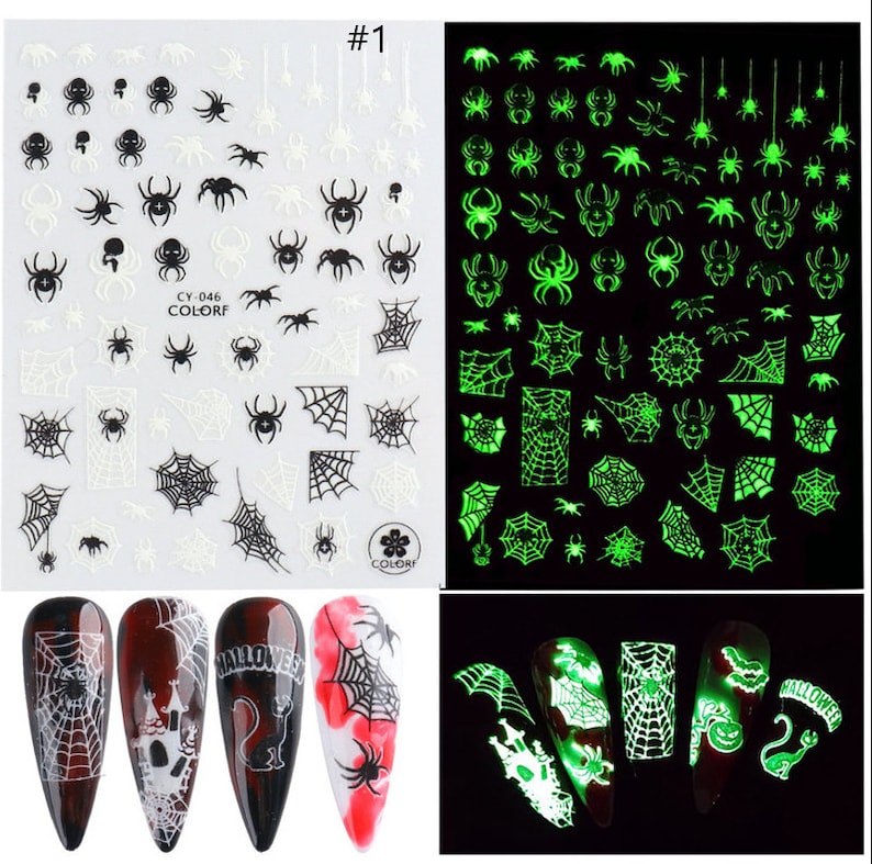 May include: Set of two sheets of glow-in-the-dark nail stickers featuring spiderwebs and spiders. The stickers are white and green. The stickers are shown on a set of four nails with a Halloween theme.