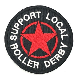 May include: A black and red embroidered patch with a white star and the text "Support Local Roller Derby".