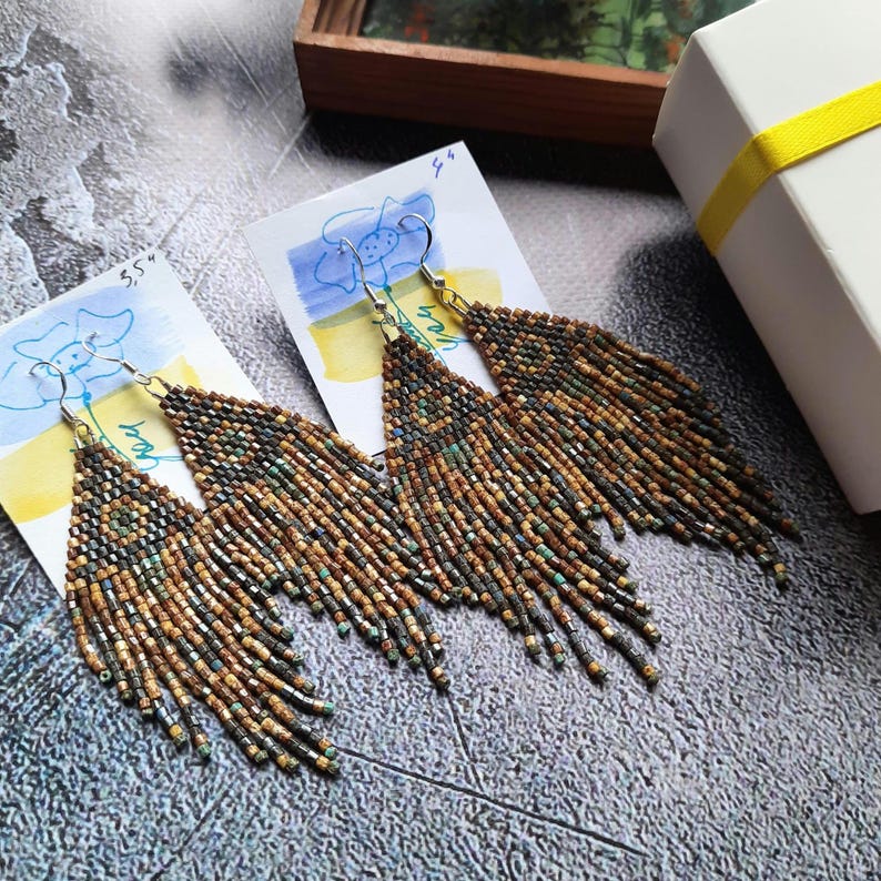 Beaded earrings are gift wrapped with a ribbon bow