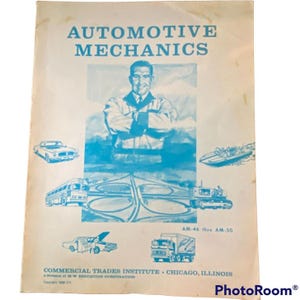May include: Vintage automotive mechanics textbook cover with blue text and illustrations. The cover features a portrait of a man and various vehicles, including cars, a bus, and a truck. The text reads "AUTOMOTIVE MECHANICS".