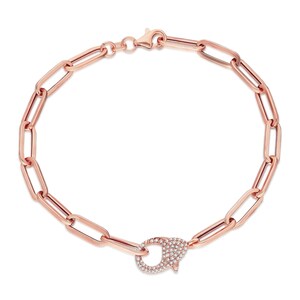 May include: A rose gold chain bracelet with a pave diamond clasp. The chain is made of oval links.