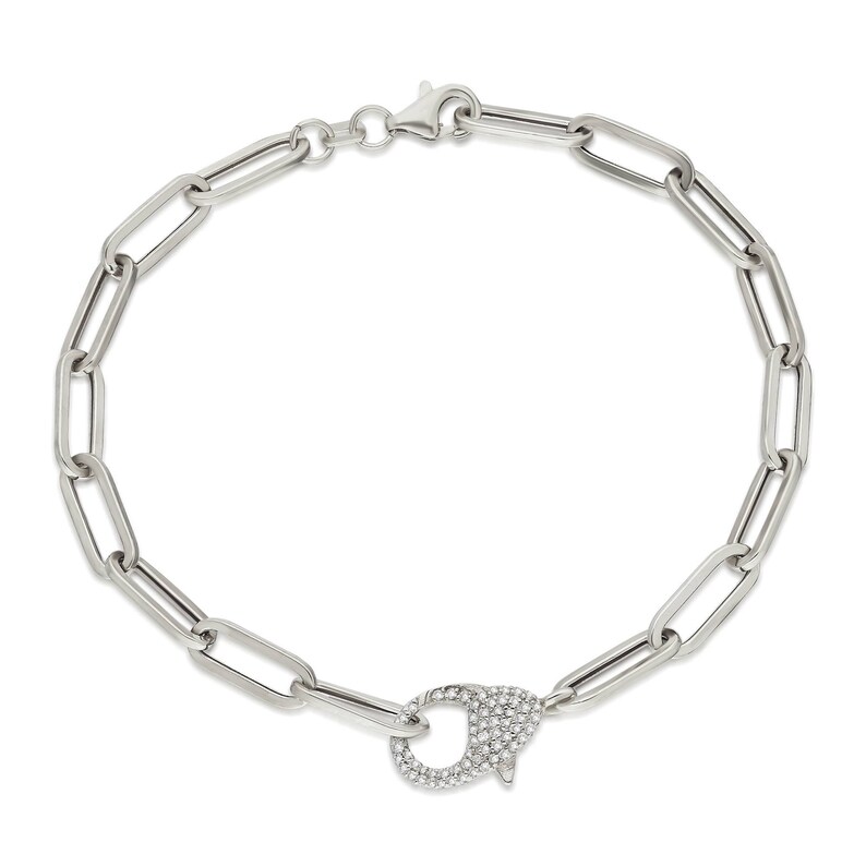 May include: A silver chain bracelet with a silver clasp set with clear cubic zirconia stones.