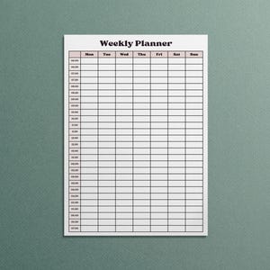 May include: A white weekly planner with a grid layout for scheduling appointments and tasks. The planner has a header that reads "Weekly Planner" and includes time slots from 6:00 AM to 7:00 PM. The days of the week are listed across the top.