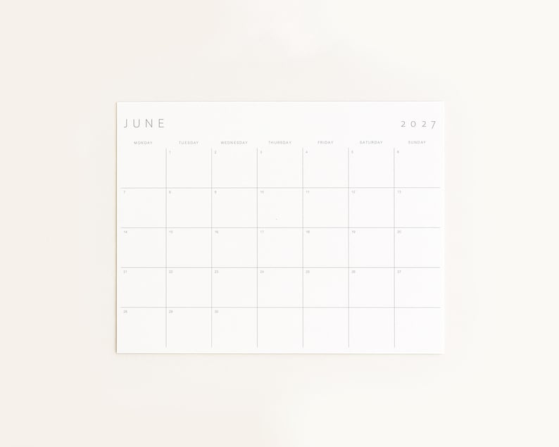 June 2027 printable monthly planner displayed on a soft neutral background in a clean minimalist mockup.
