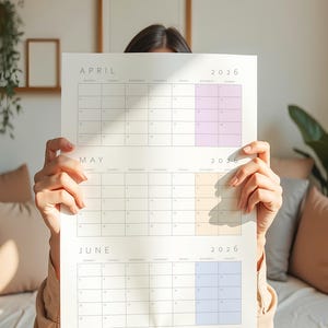 May include: A white 2026 calendar featuring the months of April, May, and June. Each month has a grid layout with dates and days of the week. The April section has a lavender accent, May has a peach accent, and June has a blue accent.