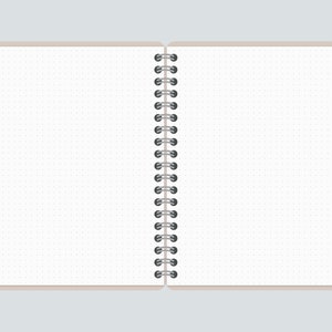 May include: A white notebook with a black spiral binding. The notebook has a dotted grid pattern on the pages.