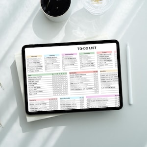 Excel productivity planner template with organized task categories and checkbox system, allowing users to manage daily tasks and long term goals in one digital spreadsheet