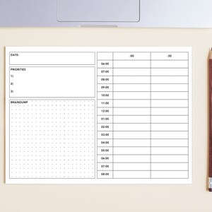 Könnte beinhalten: Ein schwarz-weißer druckbarer Tagesplaner mit Abschnitten für "Datum", "Prioritäten" und "Braindump". Der Planer verfügt über ein Raster für die Zeitverwaltung, mit Stunden von 6:00 Uhr bis 20:00 Uhr.
