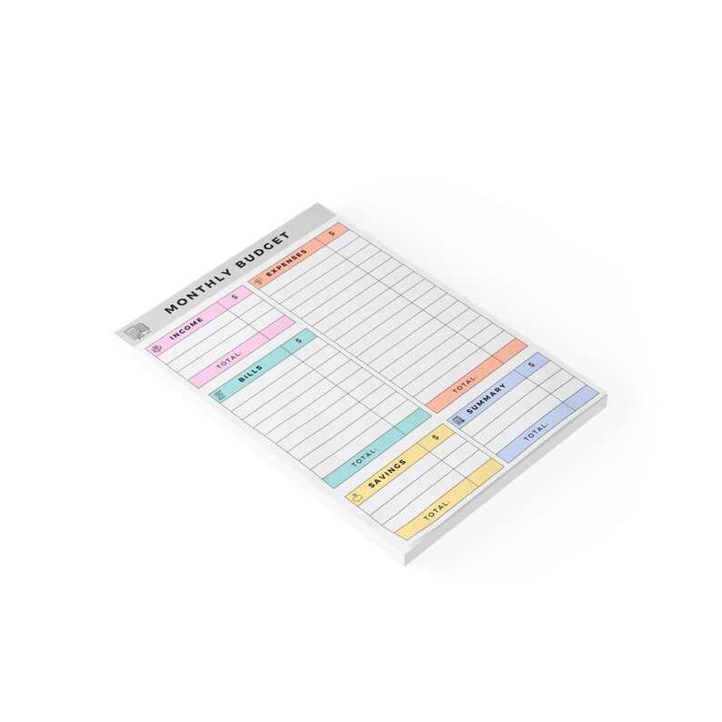 Close-up of a sticky note financial planner featuring pastel tones and cute icons for income, bills, expenses, and savings categories printed on uncoated white paper.