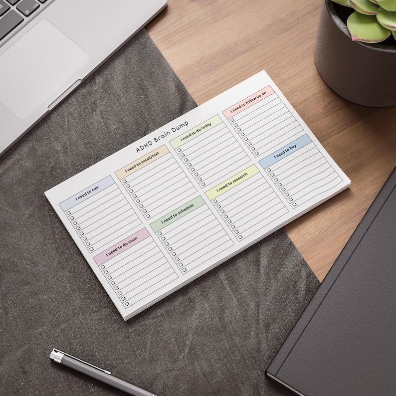 ADHD brain dump checklist notepad in 10x6 inch size, showing pastel headers and empty checkbox sections for calls, emails, tasks, and shopping on a bright neutral background.