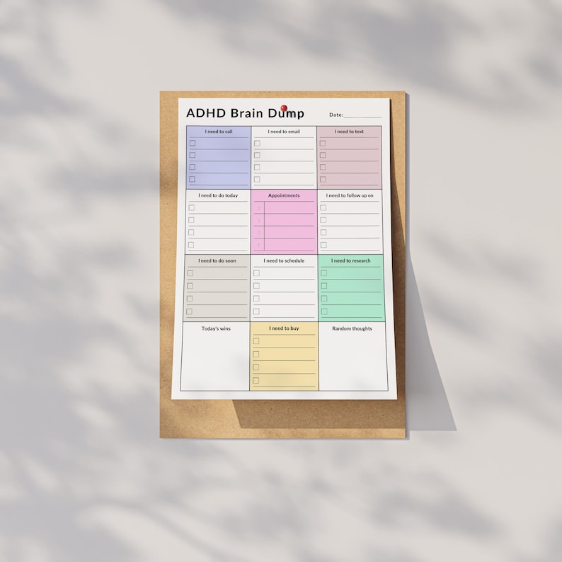 A printed ADHD daily planner displayed on a neutral-colored surface. Sections for to-dos, reminders, and notes are visible in a portrait layout, with clear text and structured formatting on white paper.