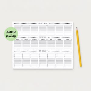 May include: A white planner with sections for categorizing, prioritizing, and scheduling tasks. The planner has a weekly layout with spaces for each day of the week. A yellow pencil rests on the right side. A green circle with the text "ADHD friendly" is on the left.