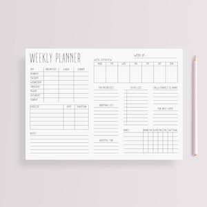 May include: A black and white weekly planner with sections for daily tasks, meal planning, exercise, shopping, and gratitude. The planner includes a week overview, top priorities, to-do list, calls/emails to make, and a habit tracker.