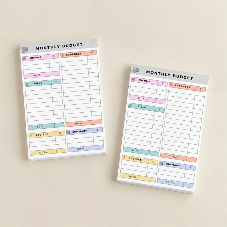 Top-down view of sticky note budget pad with 50 sheets, pastel headers dividing income, expenses, savings, and bills, compact design suitable for planners, desks, or portable use.