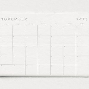 Sleek planner template set against a soft grey background.