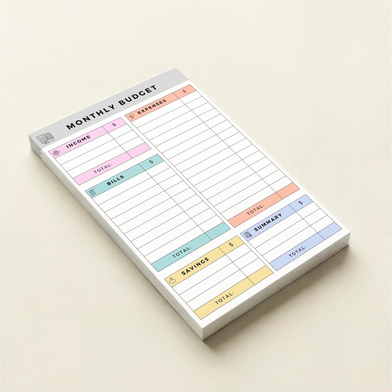 Small 4x6 Post-it style notepad for tracking bills, income, savings, and expenses with pastel headers and icons, single-sided printed sheets neatly stacked for personal budgeting at home or office.