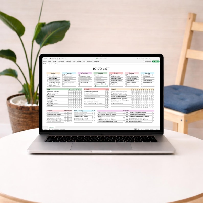 Excel task tracker template with sections for daily weekly monthly and yearly planning, featuring checkboxes and color coded headers, shown on a laptop screen with structured spreadsheet layout