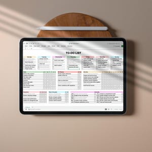 Editable Excel to do list template with color coded sections and checkboxes for tracking tasks across different timeframes, displayed on screen with clear and minimal layout
