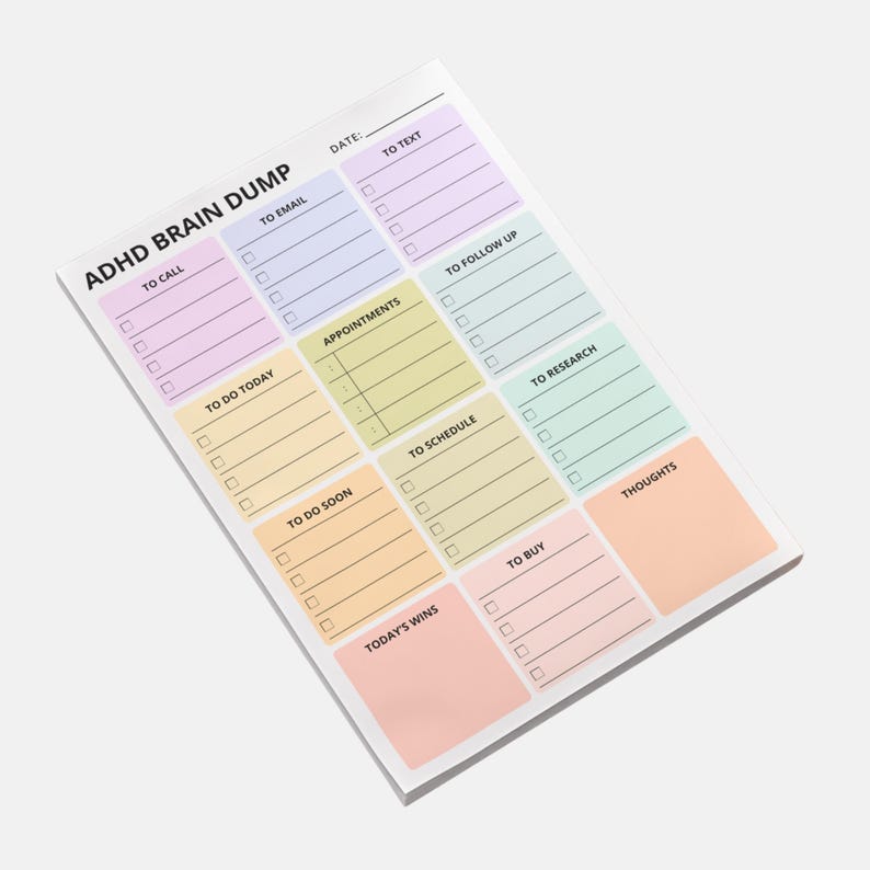 A brain dump sticky note pad designed for ADHD, lying flat on a desk, showing multiple empty sections ready for writing. Minimal 4x6 Post-it format with clean lined structure.