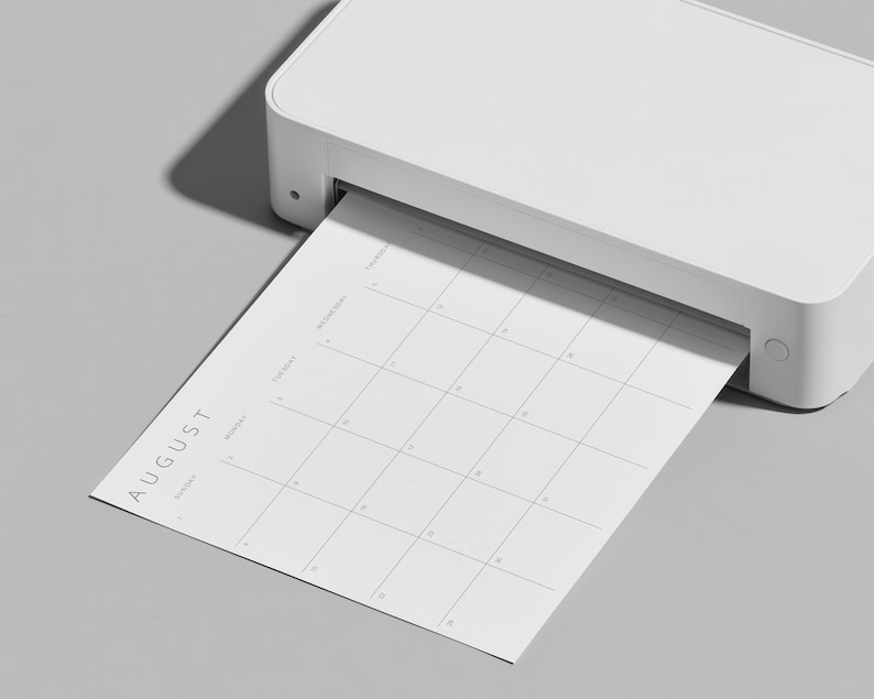 Minimalist 2027 monthly planner page printing from a home printer, showing the instant printable PDF format.