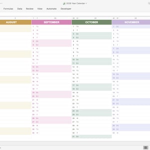 Minimalist workspace with 2026 Excel calendar on monitor, perfect for work, study, and personal planning
