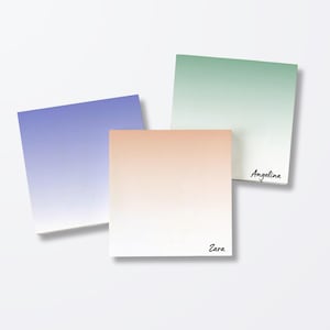 May include: Three square sticky notes with a gradient color scheme. One is lavender, one is peach, and one is green. The peach note has the name "Zara" printed on it, and the green note has the name "Angelina" printed on it.