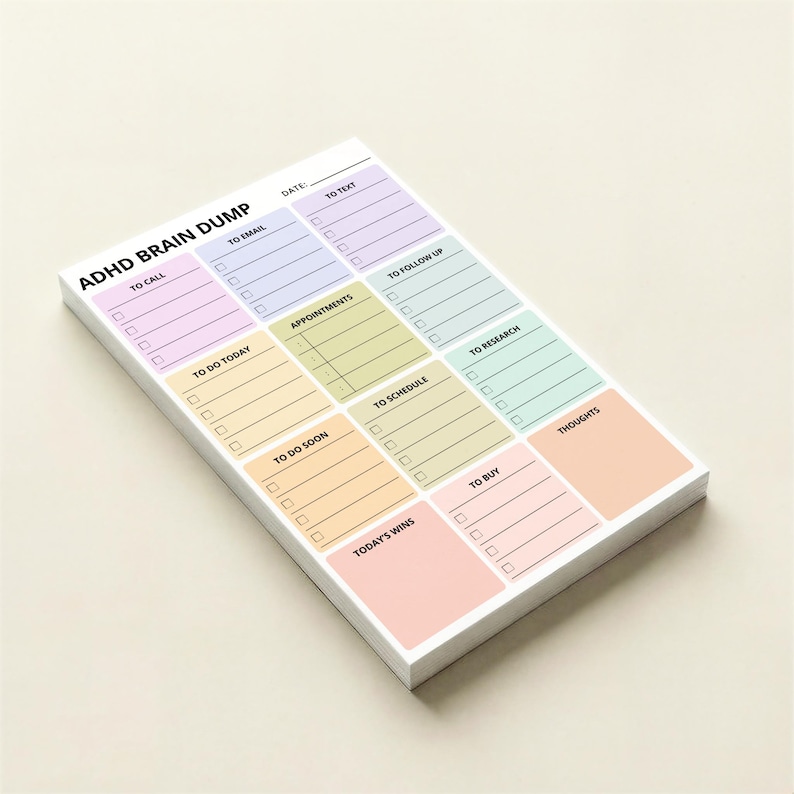 Pastel rainbow ADHD brain dump notepad with compact 4x6in sticky sheets, divided sections for tasks, ideas, reminders, and notes, designed for focus, organization, and visual clarity.