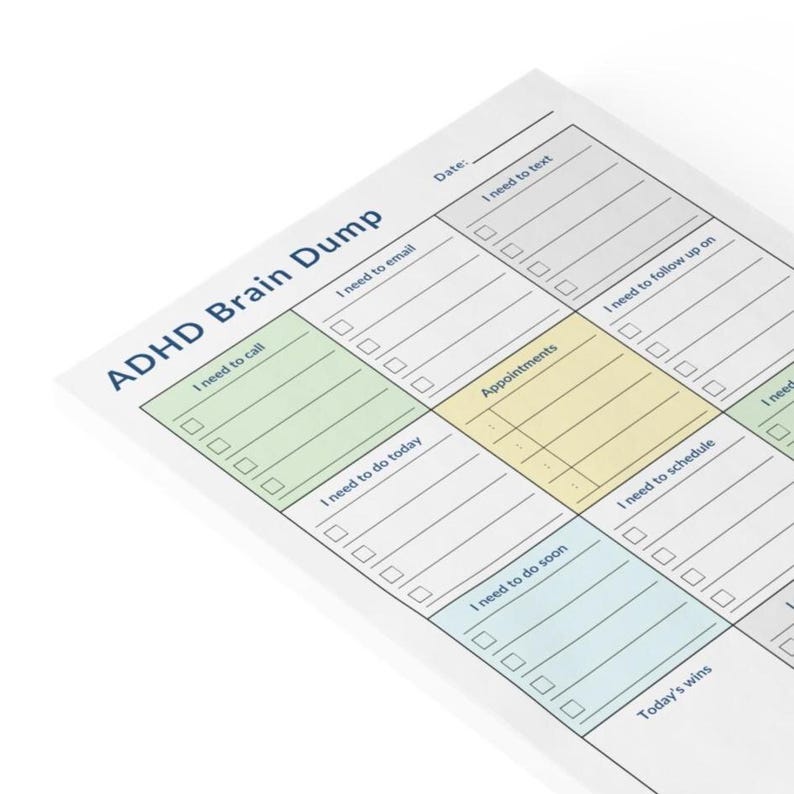 Outdoor flat lay of ADHD daily planner sticky note pad on a stone surface, featuring colorful section headers and printed checklist layout for daily tasks, schedule, and brain dump.