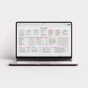 Digital Excel planner template with task tracking system for daily weekly and monthly organization, featuring simple layout, checkboxes, and customizable headers, shown on a desktop workspace