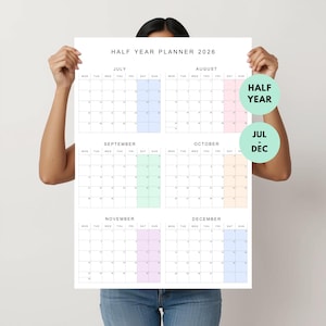 May include: A white 2026 half-year planner showing calendar grids from July to December. Each month has a grid of dates, with highlighted sections in pastel colours. The text "HALF YEAR PLANNER 2026" is at the top of the planner.
