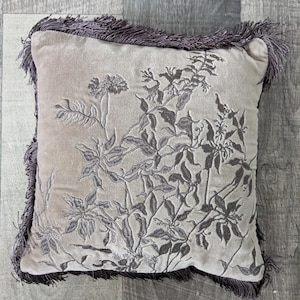Small brown tasseled cushion
