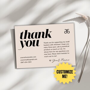 May include: A beige thank you card with black text. The words "thank you" are prominently displayed. Additional text includes contact information and a message of appreciation. A yellow starburst says "Customize Me!"