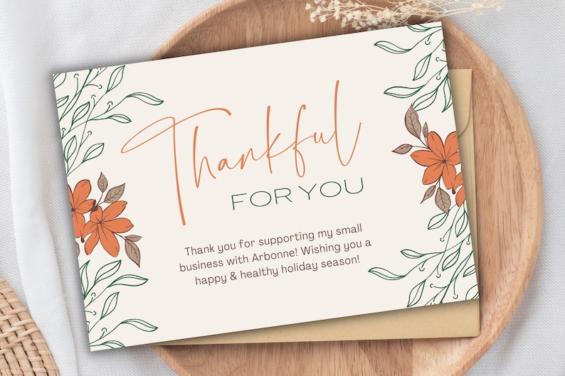 May include: A thank you card with a floral design in shades of green and orange. The card says "Thankful for you" and "Thank you for supporting my small business with Arbonne! Wishing you a happy & healthy holiday season!"