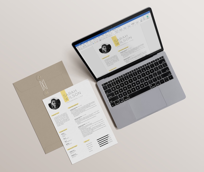 May include: A laptop computer with a resume open on the screen. The resume is for Sarah Wilson and features a professional headshot. A printed copy of the resume is on a beige envelope.