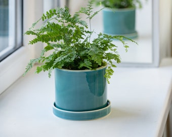 Teal cylinder plant pot