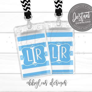May include: Two clear plastic badge holders with blue and white striped inserts. The inserts have a blue monogram with the letters "LIR" in a white frame.