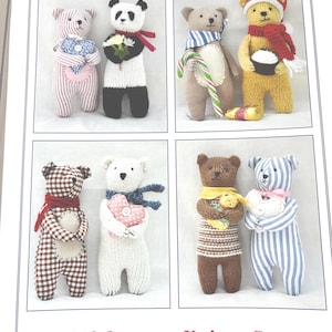 May include: A page from a knitting pattern book showing several knitted bear designs. The bears are dressed in various outfits, including scarves and hats, and some hold hearts or flowers. The text reads "Knits & Pieces" and "Gift bears to Knit or Sew". The bears are approximately 20 cm tall.