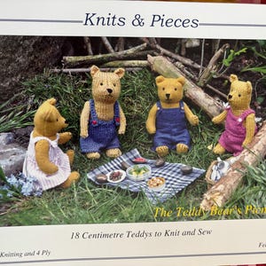 May include: An image from "Knits & Pieces" showing four knitted teddy bears at a picnic. The bears are dressed in dungarees and dresses. The text reads "The Teddy Bear's Picnic" and "18 Centimetre Teddys to Knit and Sew", which is approximately 7 inches.