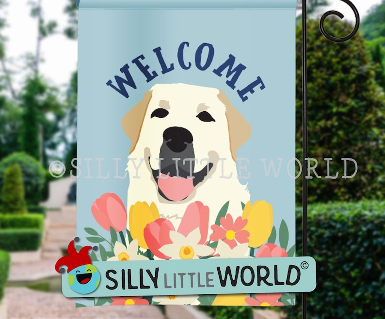 May include: Welcome garden flag featuring a white Labrador Retriever with a pink tongue sticking out, surrounded by colorful flowers. The flag has a blue background with the word "WELCOME" in white letters. The flag is made by Silly Little World.