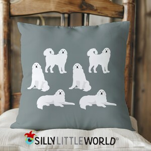 May include: A gray throw pillow with a white silhouette of Great Pyrenees dogs in various poses. The pillow has the text "Silly Little World" printed on the bottom.