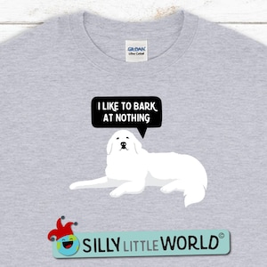 May include: A gray t-shirt with a white dog and a speech bubble that says "I like to bark at nothing". The text "Silly Little World" is at the bottom of the shirt.