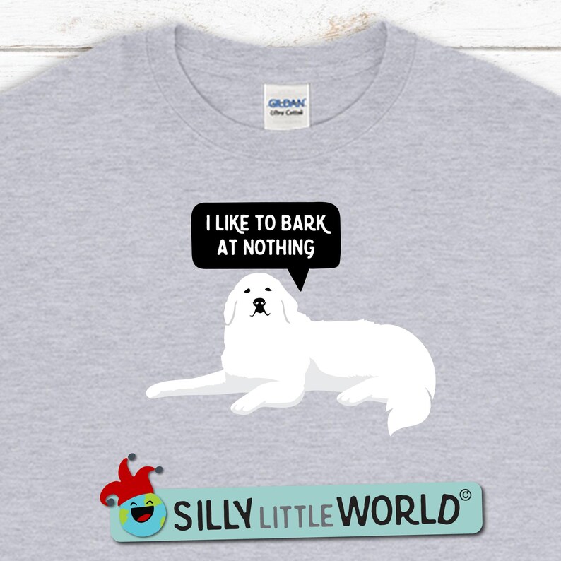 May include: A gray t-shirt with a white dog and a speech bubble that says "I like to bark at nothing". The text "Silly Little World" is at the bottom of the shirt.
