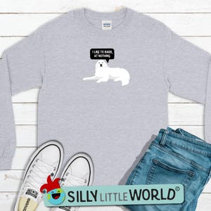 May include: A gray long-sleeved t-shirt with a white dog illustration and the text "I like to bark at nothing".
