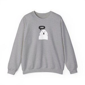 May include: A gray sweatshirt with a white dog wearing a speech bubble that says "nope".