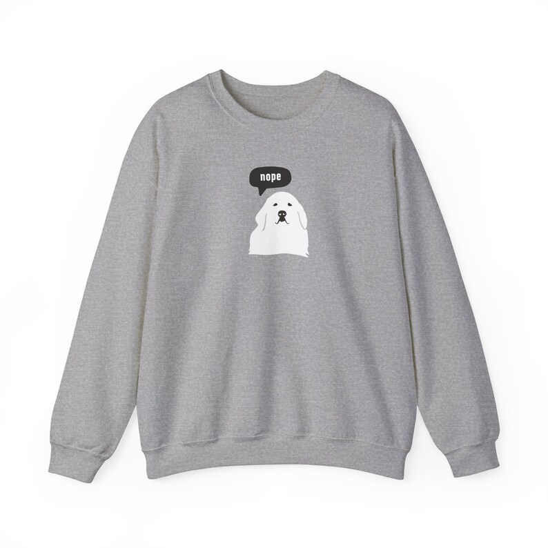 May include: A gray sweatshirt with a white dog wearing a speech bubble that says "nope".