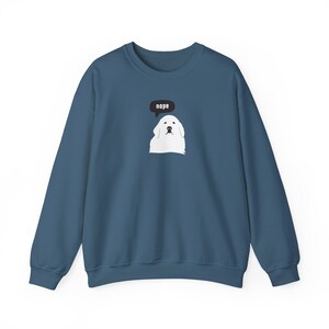 May include: A dark blue sweatshirt with a white dog illustration and a speech bubble that says "nope".