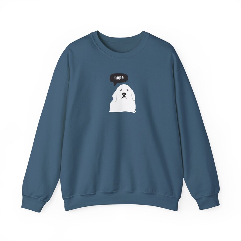 May include: A dark blue sweatshirt with a white dog illustration and a speech bubble that says "nope".