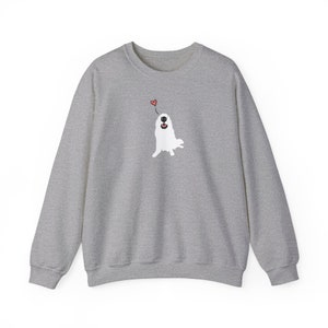 May include: A grey sweatshirt featuring a white dog illustration with a red heart above its head.